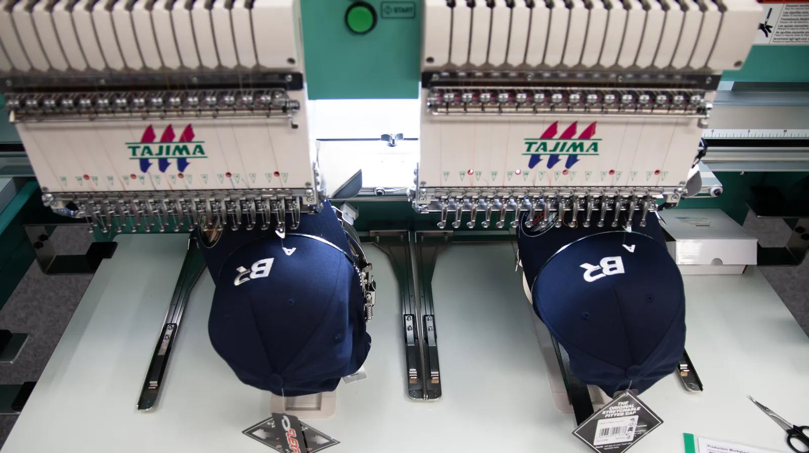 Close up of a cap being embroidered on a Tajima machine at BR Apparel in Bradford