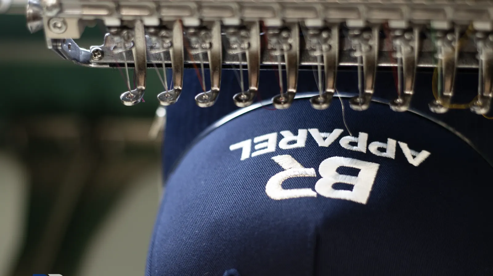Finished embroidered logo on a branded cap at BR Apparel