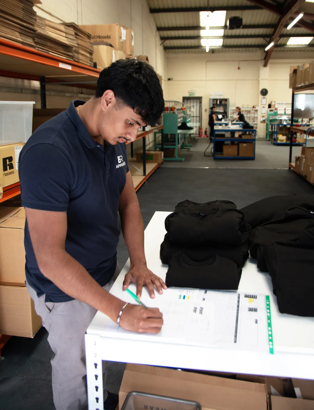 Branded garments being packed for dispatch at the BR Apparel Bradford facility