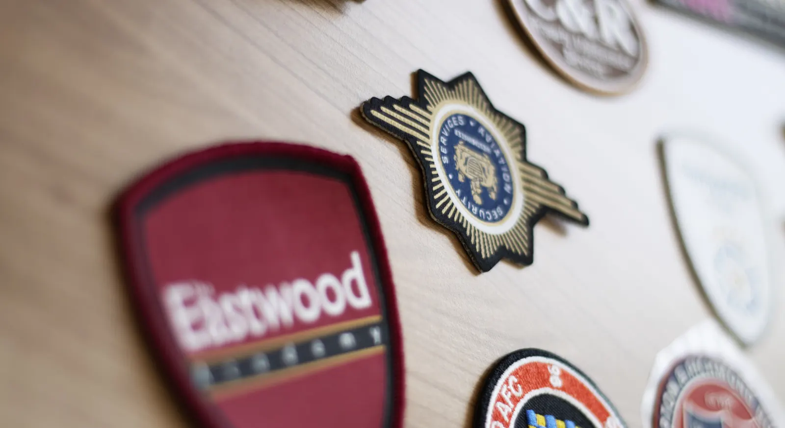 Embroidered badges and woven crests produced at BR Apparel in Bradford