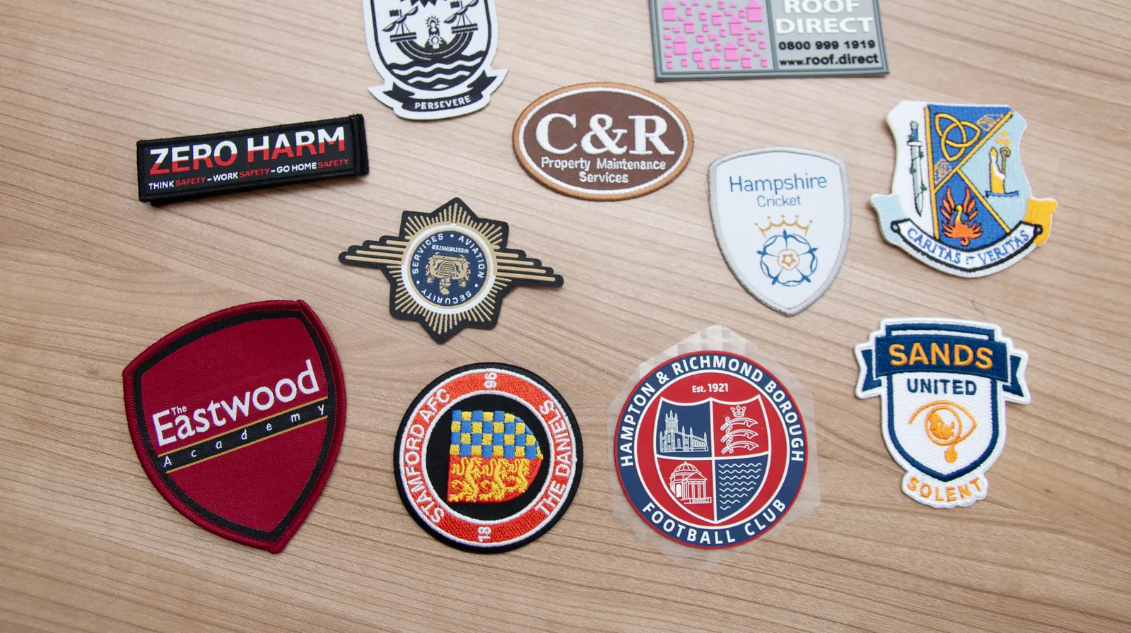 Selection of branded embroidery patches and logo samples
