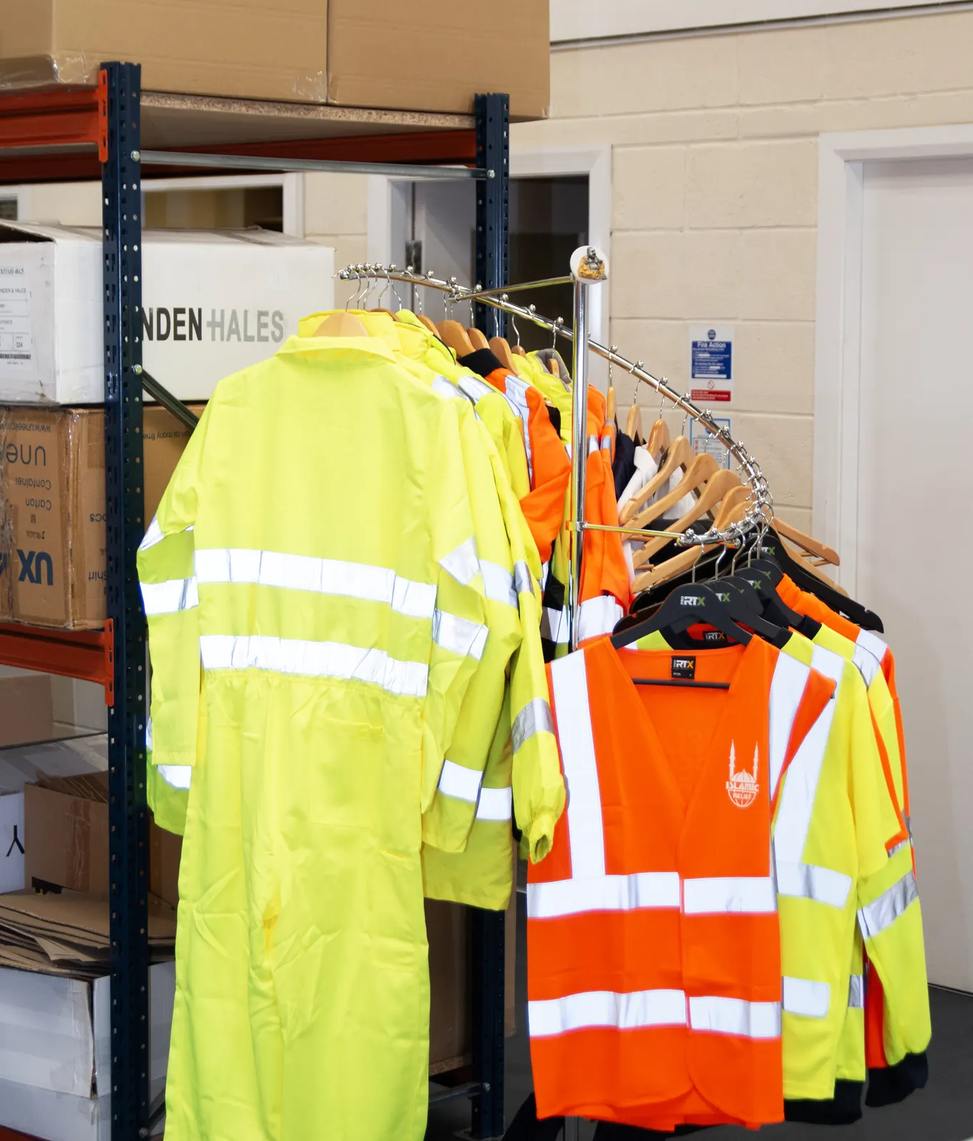 Hi-vis workwear on a rail ready for branding at BR Apparel in Bradford