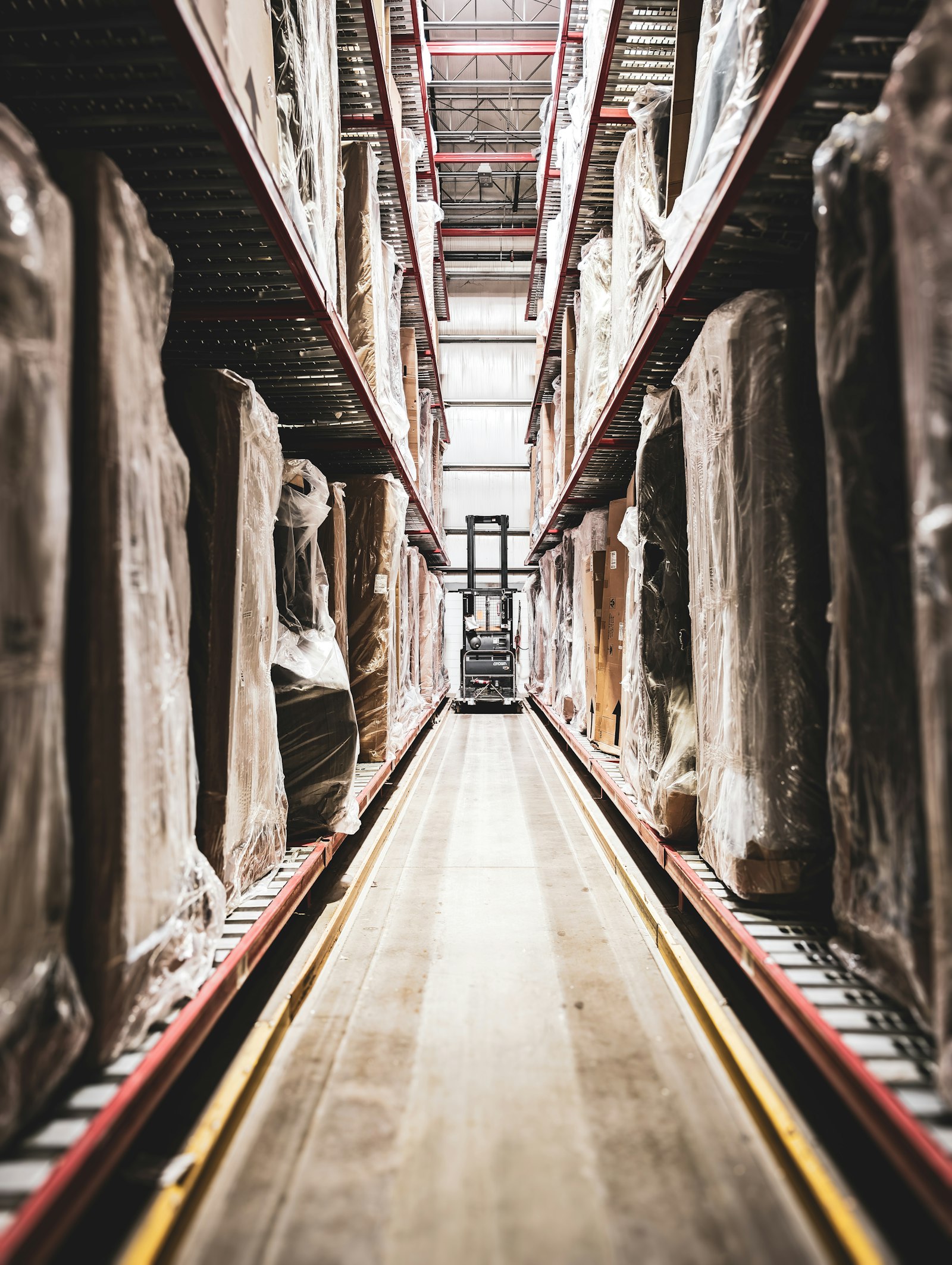 Warehouse racking aisle stocked for a peak-season distribution operation