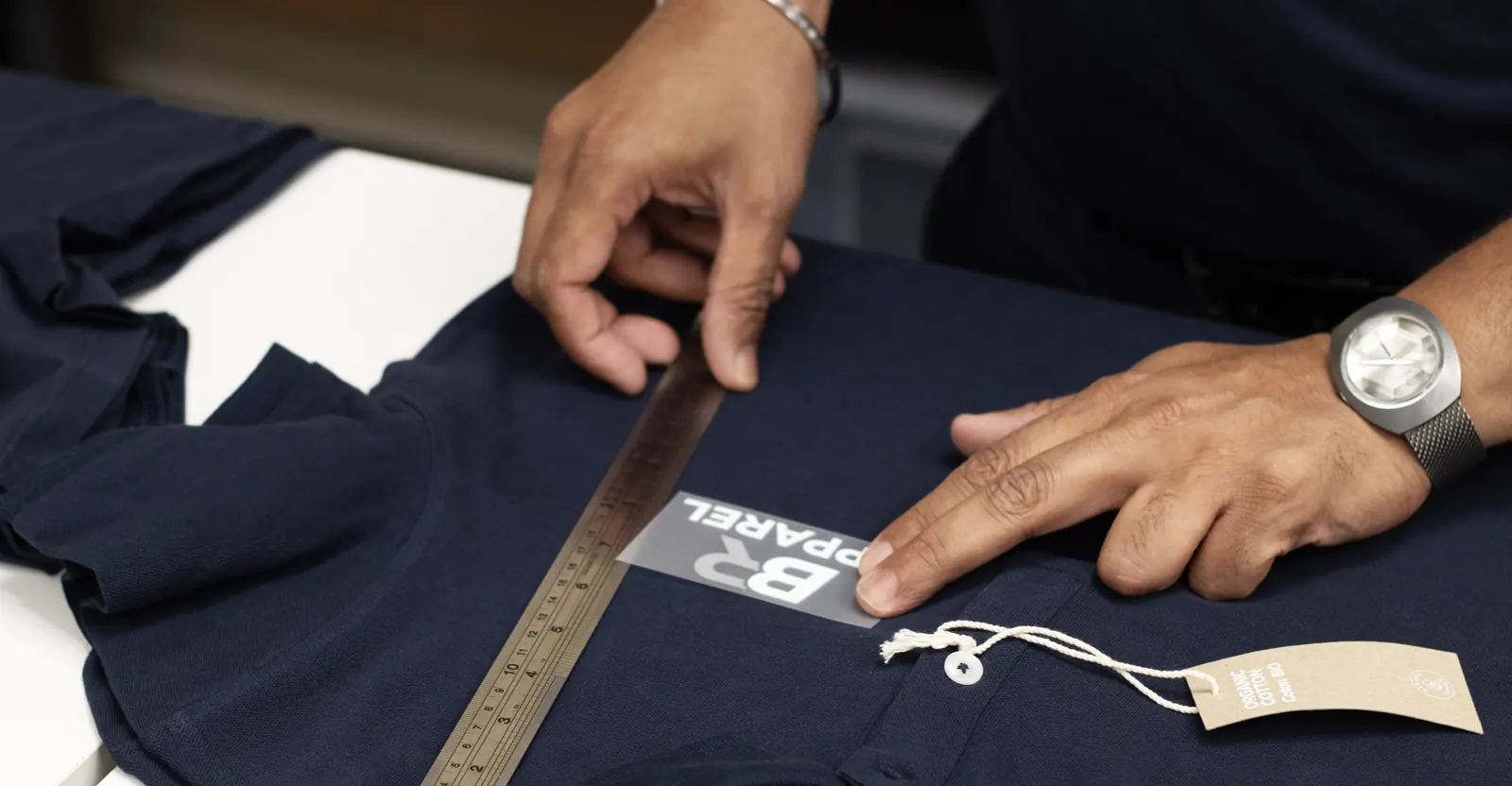 Measuring logo placement on a garment before production at BR Apparel
