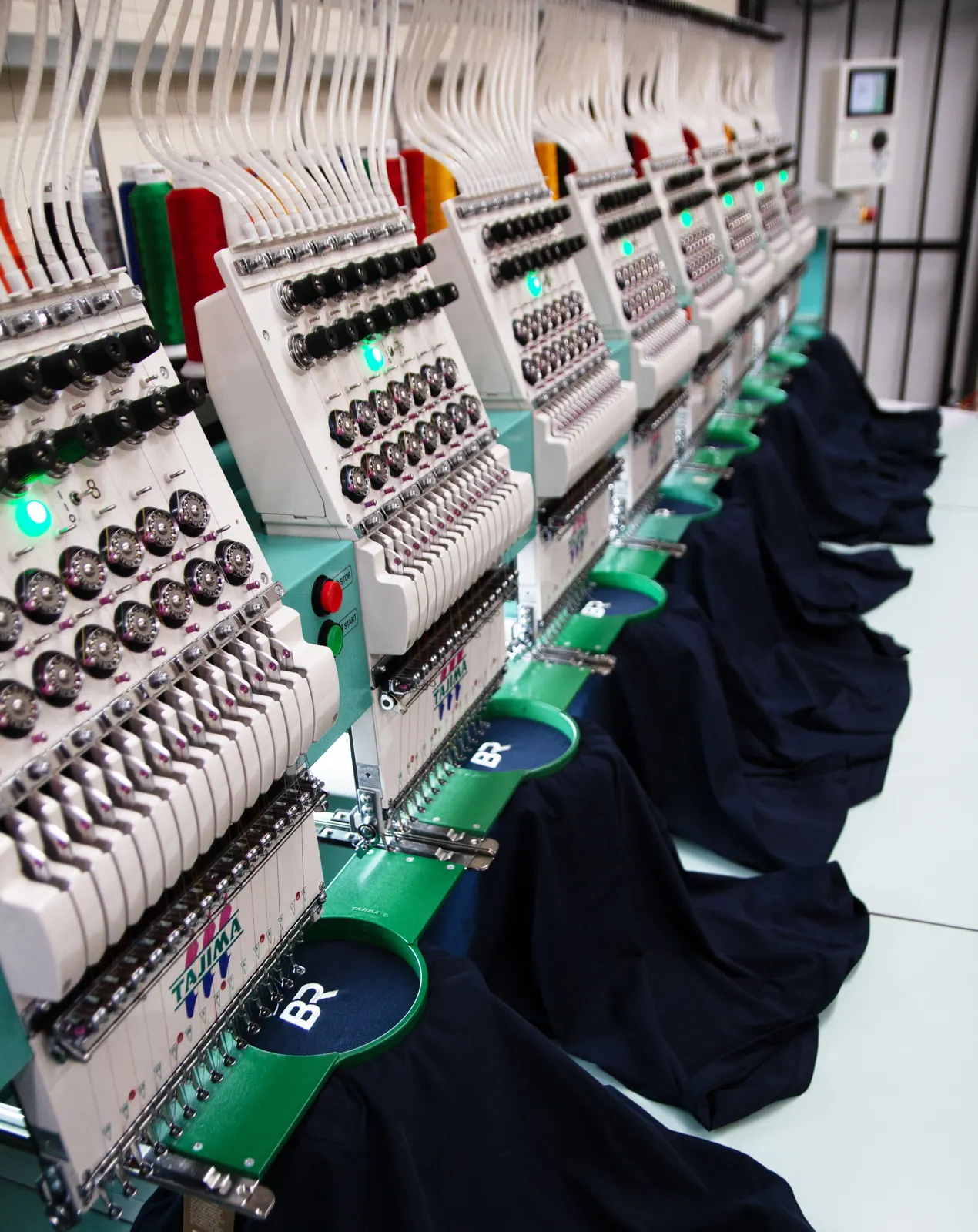 Multi-head embroidery machines running branded workwear at BR Apparel in Bradford