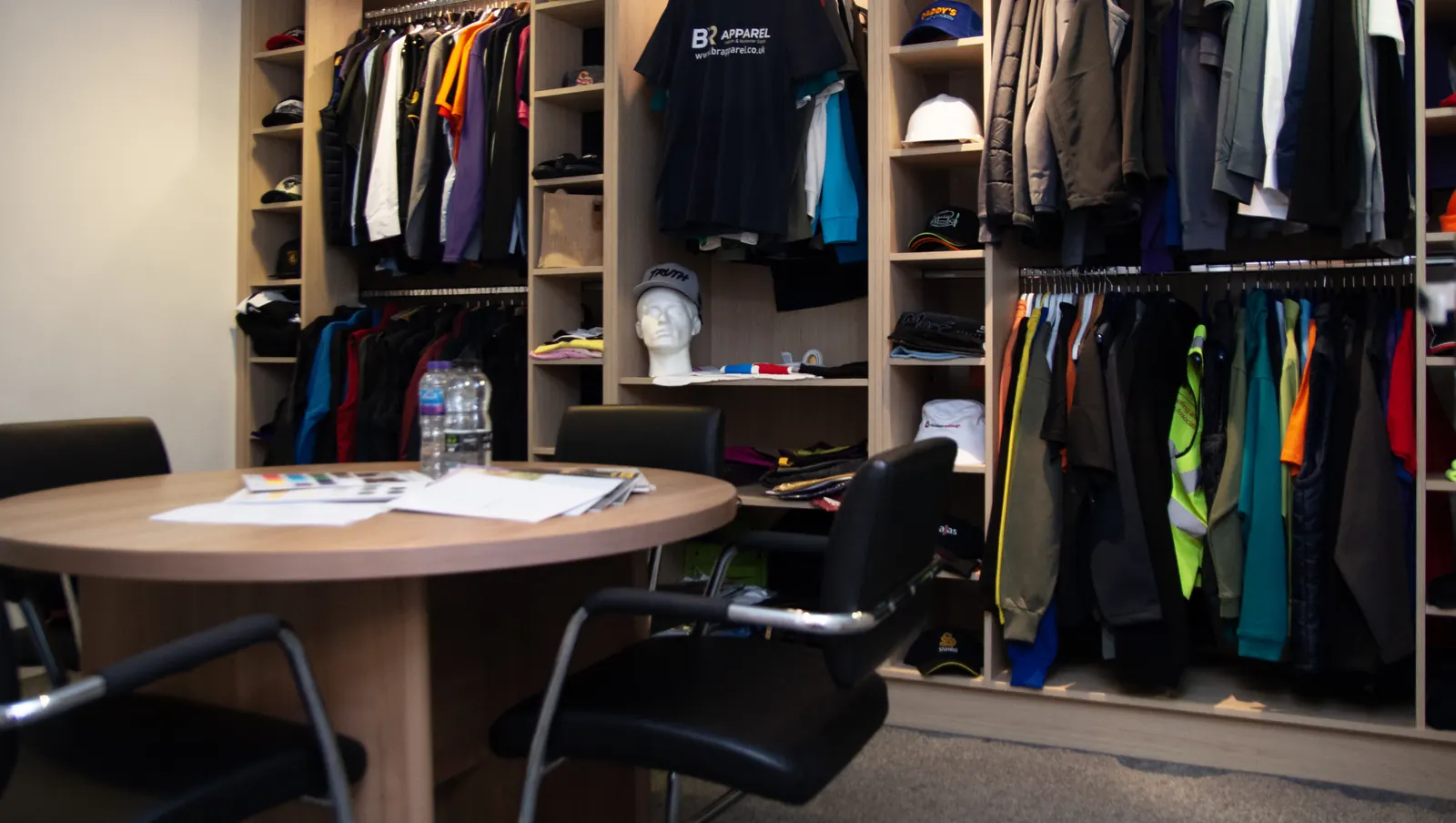 Consultation table and workwear rails in the BR Apparel showroom